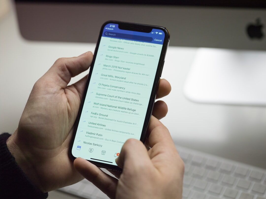 person using smartphone for insurance app