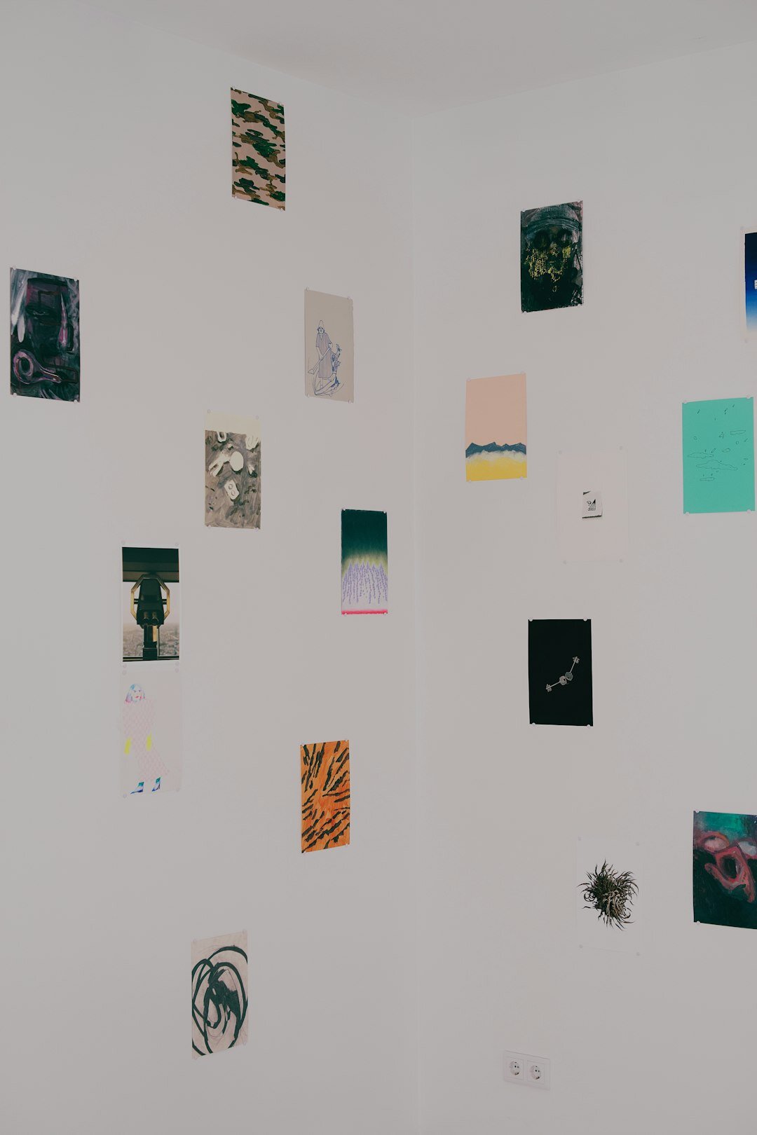 Framed documentary photography prints hanging in a small gallery